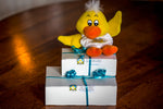 2 gift wrapped boxes of Lucky Duck Fudge stacked on top of one another, with a yellow Lucky Duck Fudge plushie sitting on top.